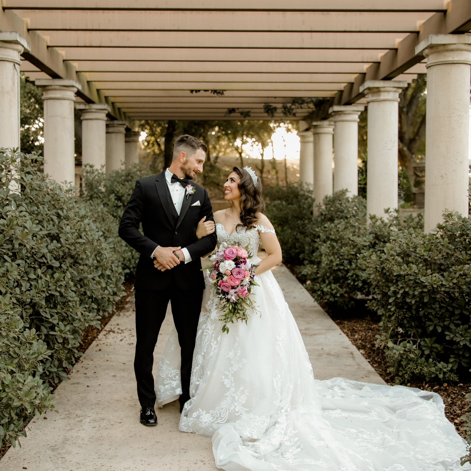 Couple walking through columns