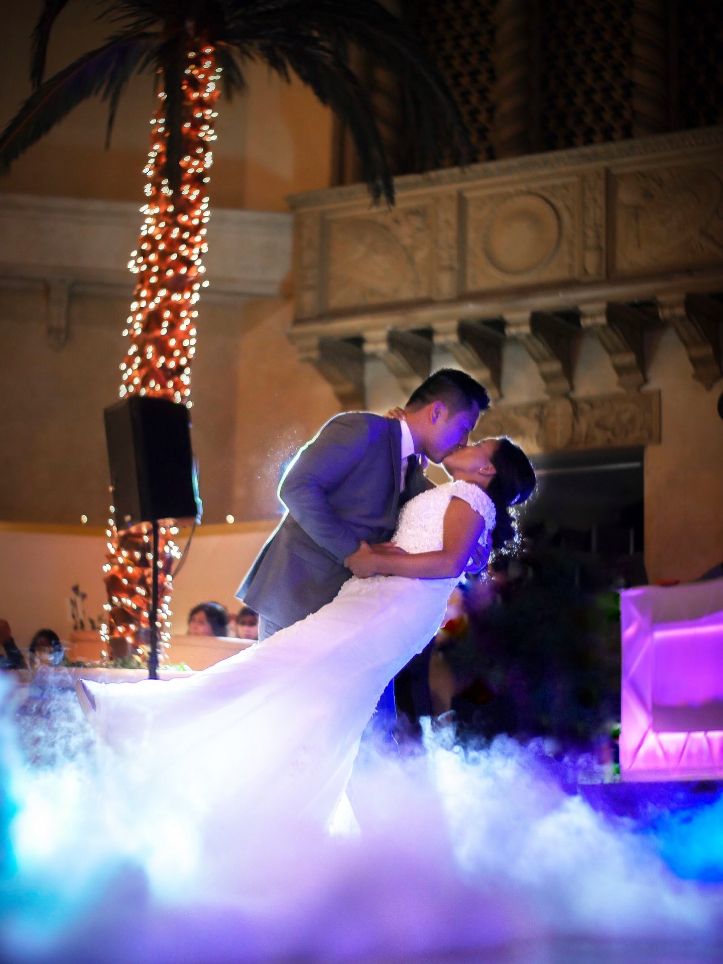 Couple kissing with fog machine
