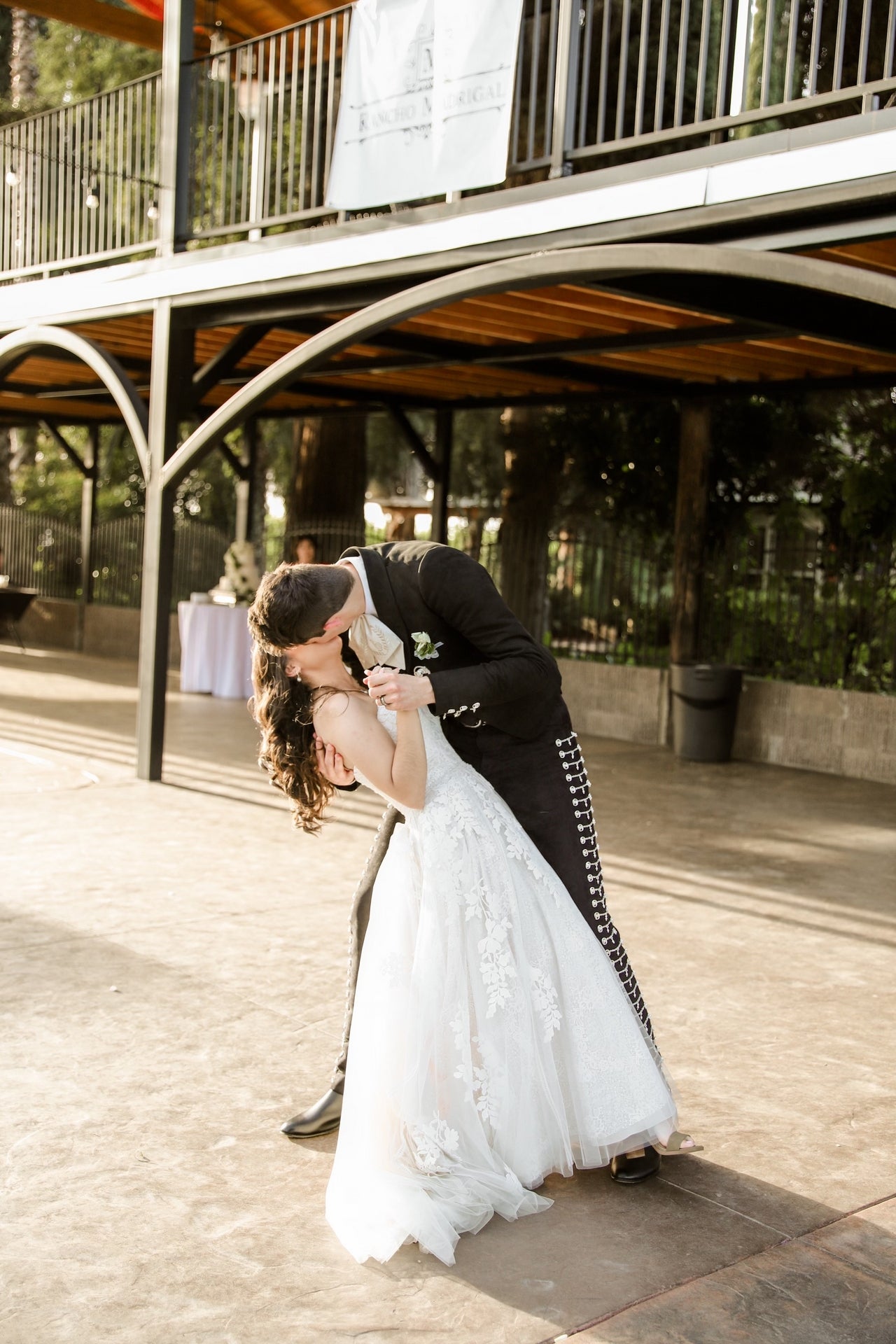 Couple kissing on ranch