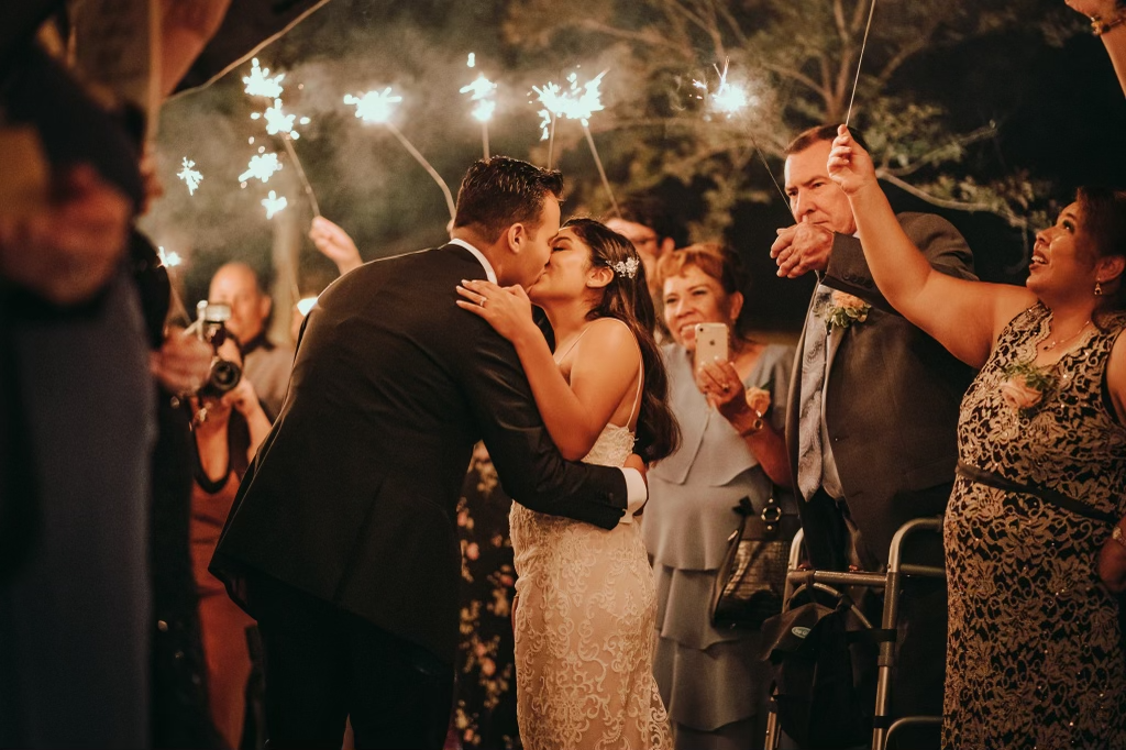 Couple kissing with the background of firecrackers.